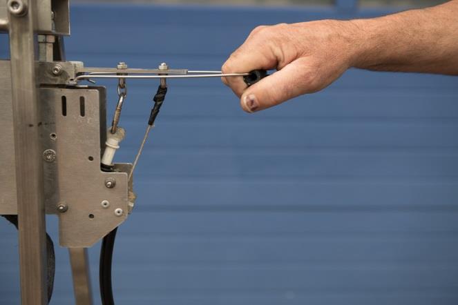 Fig. 13 Cocking the cutter with the cocking bracket
