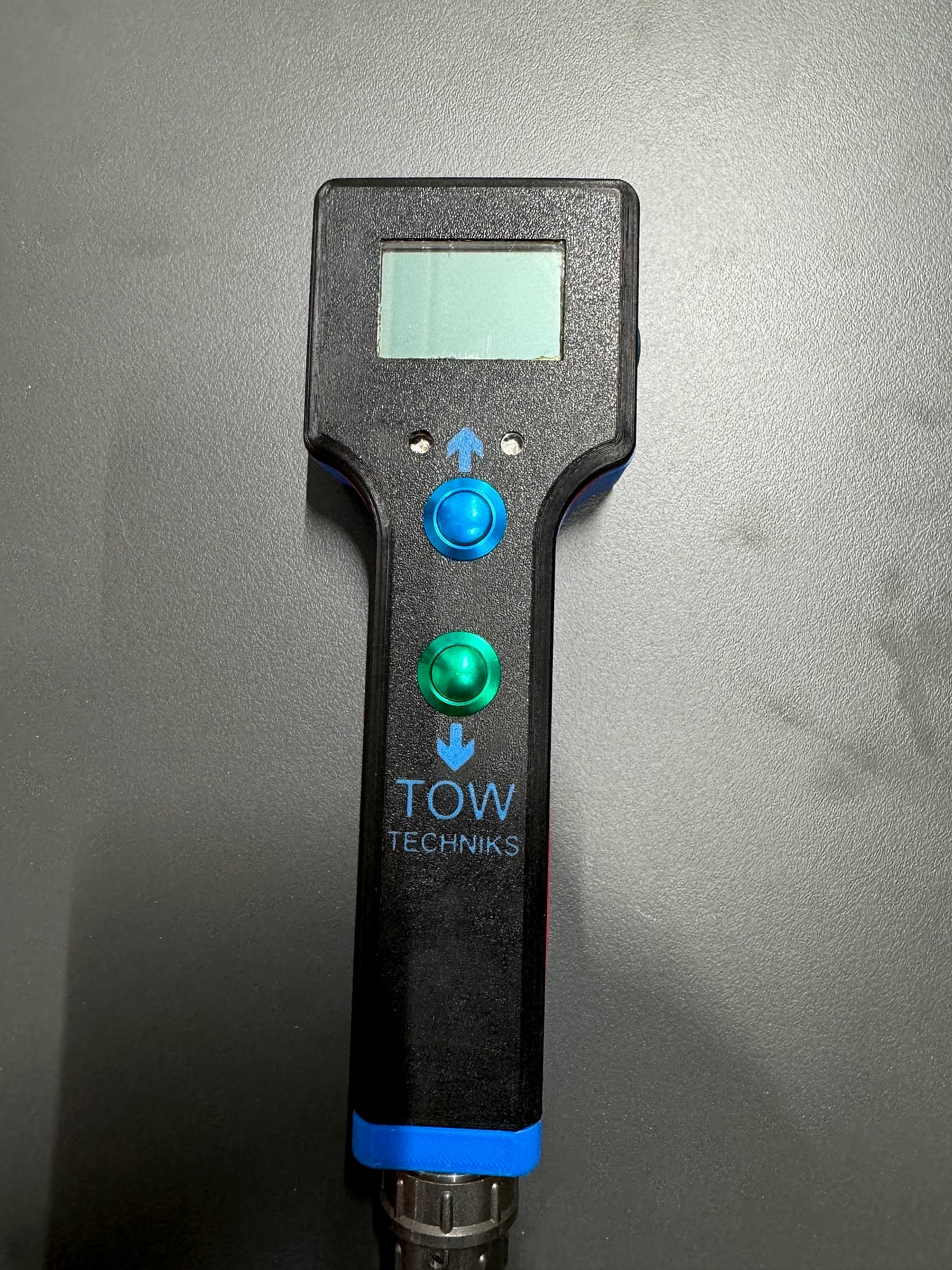 Front of the remote control with the display and the two control buttons